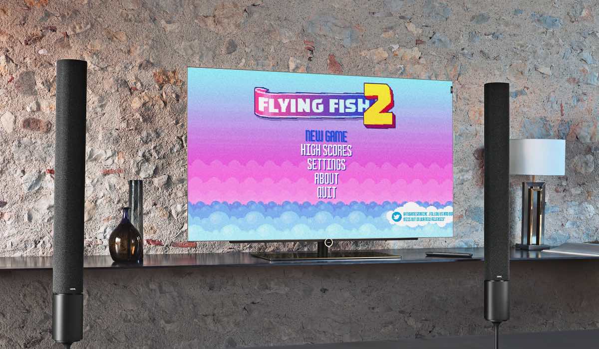 Flying fish 2 game on an LG TV set against a stone wall with 2 sound columns on either side