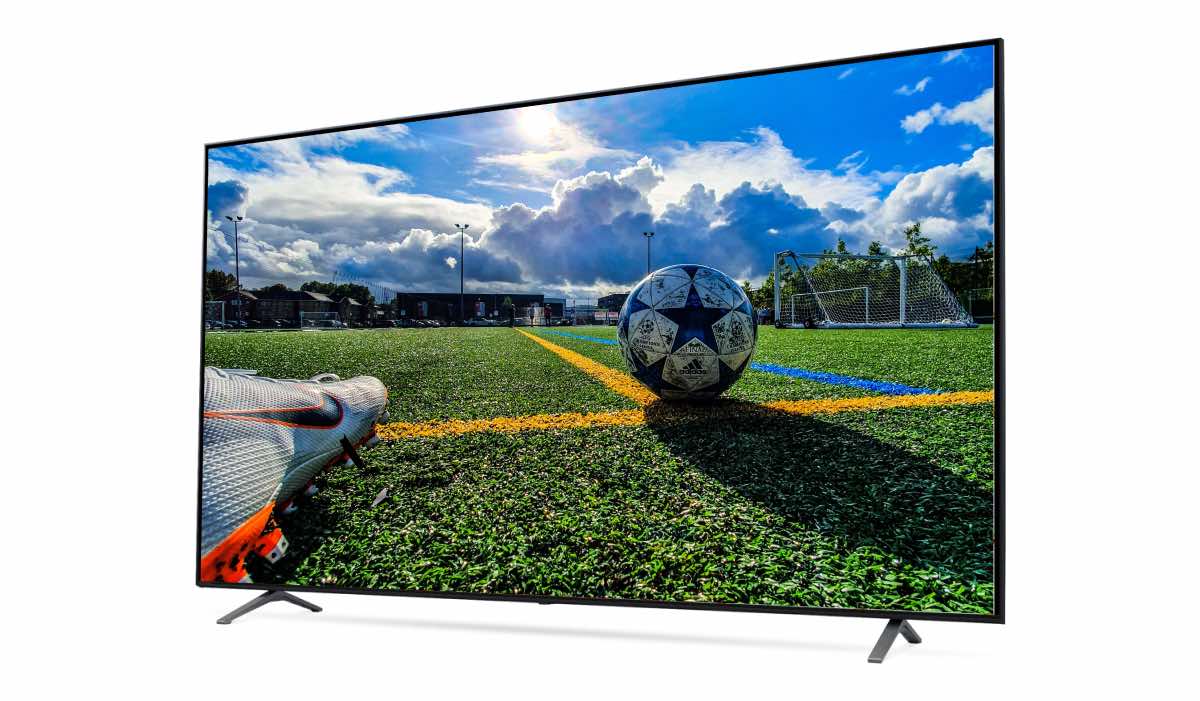 A ground-level photo of a football on a pitch on an LG TV