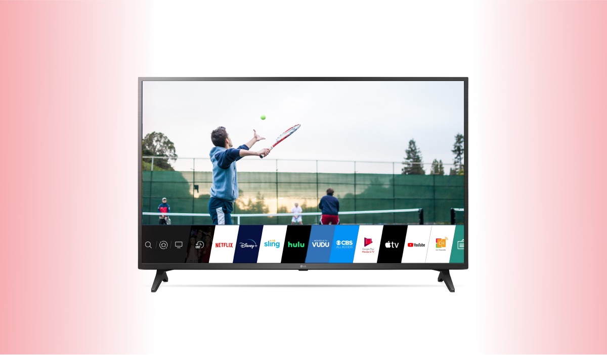 LG TV with WebOS menu interface on the screen and a man playing tennis